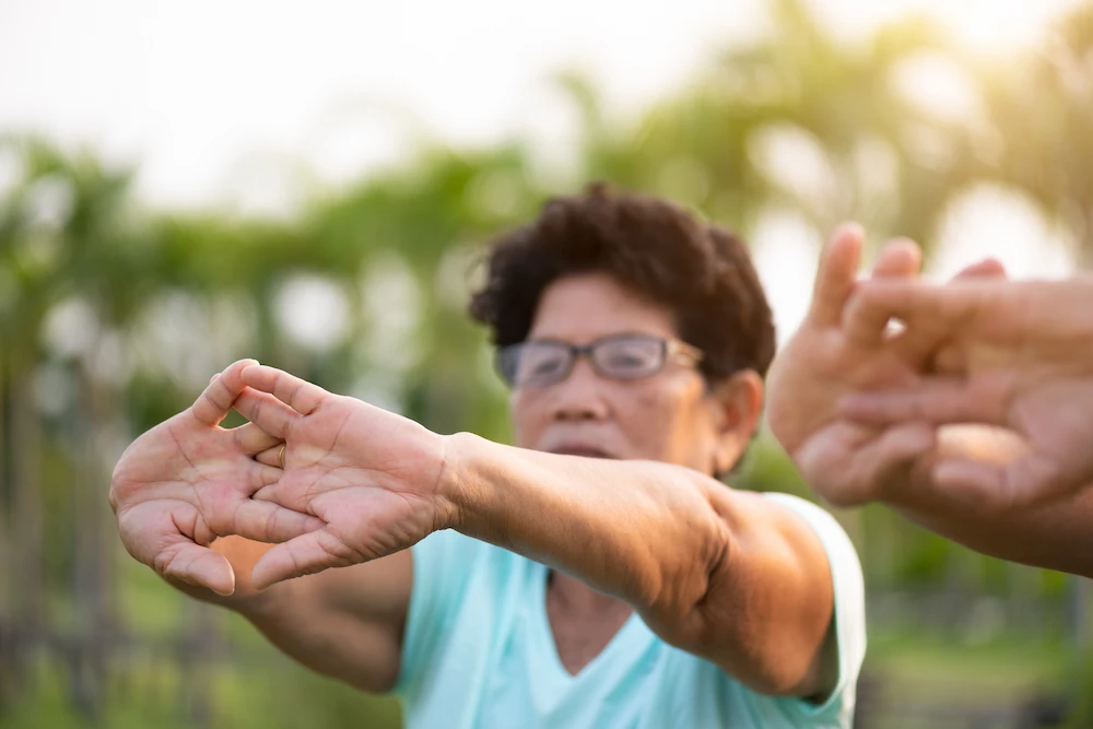 senior doing yoga golden valley senior living amenities and services