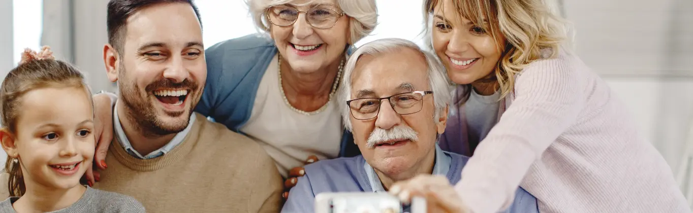 happy family taking pic with their senior dad golden valley senior living daycare service 9. Family Communication And Involvement