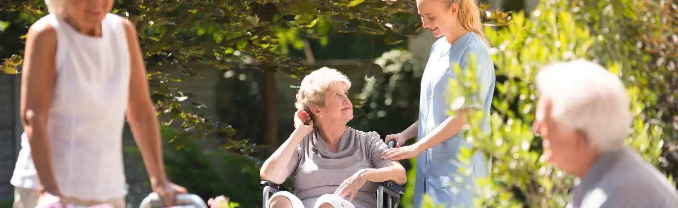 senior in garden with caretaker golden valley senior living daycare